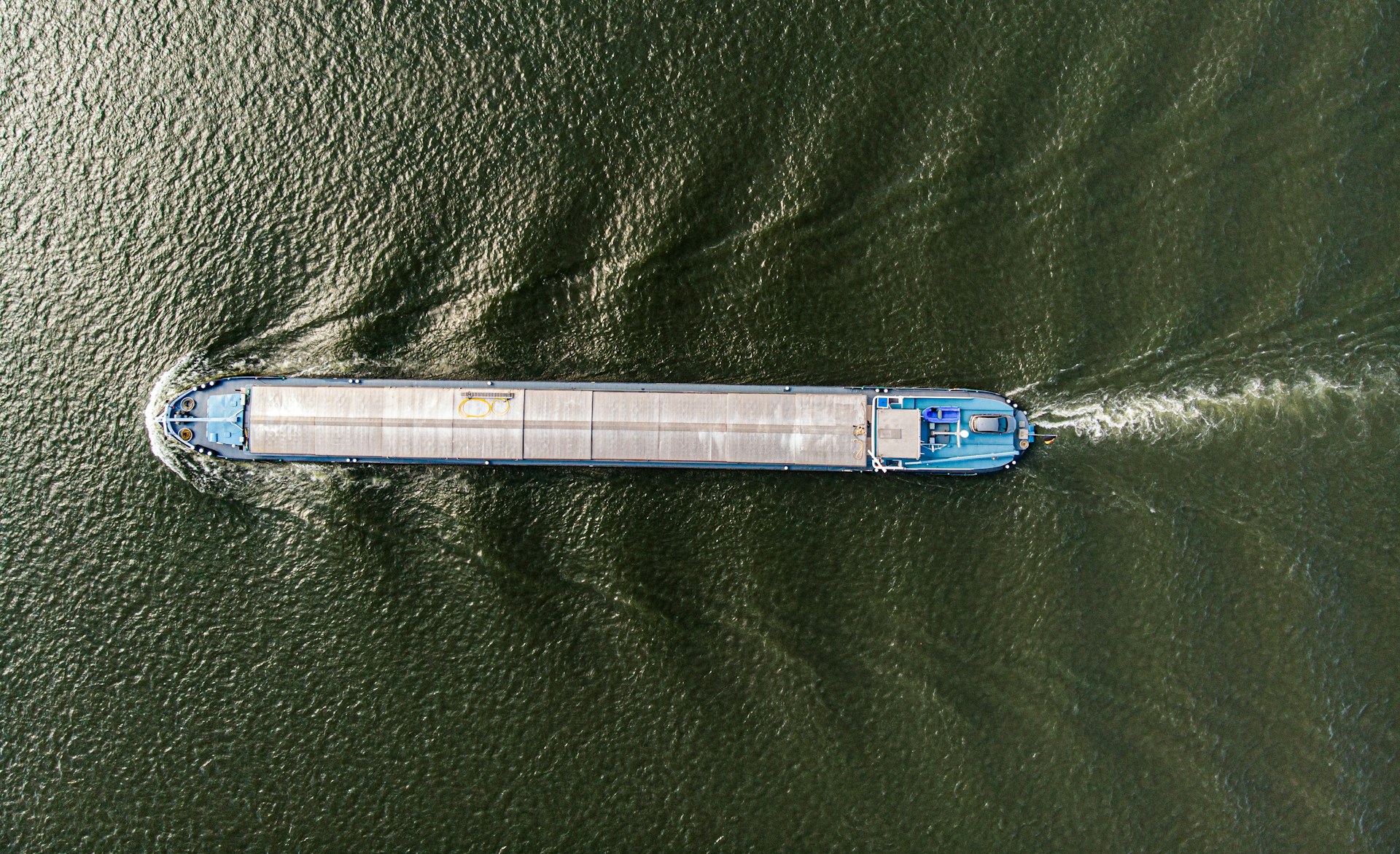 Cargo vessel viewed from above, illustrating product traceability, data flow, and transparency across the value chain