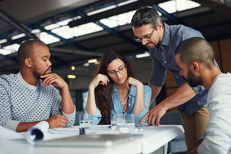 Business professionals meeting around a table