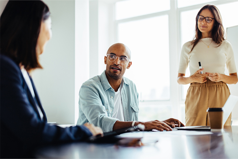 Three people in a meeting