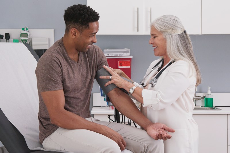 man in doctor's office getting a checkup