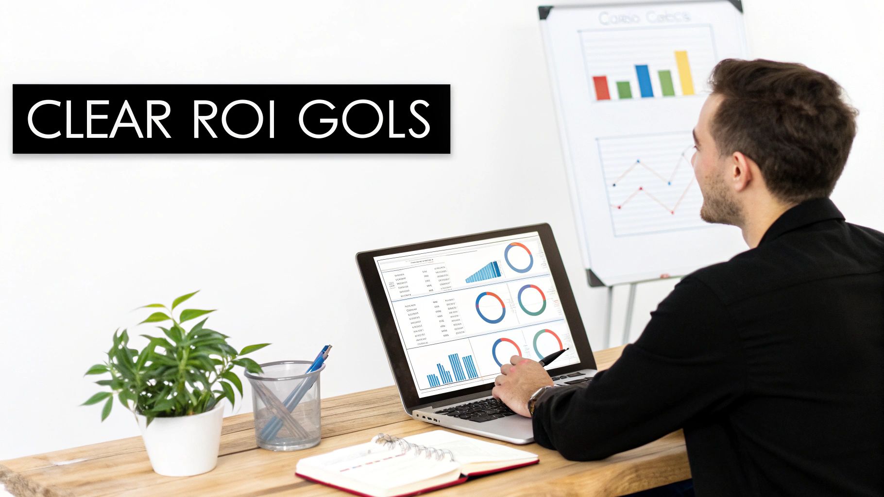 A person reviews business data and clear ROI goals on a laptop in a modern office.