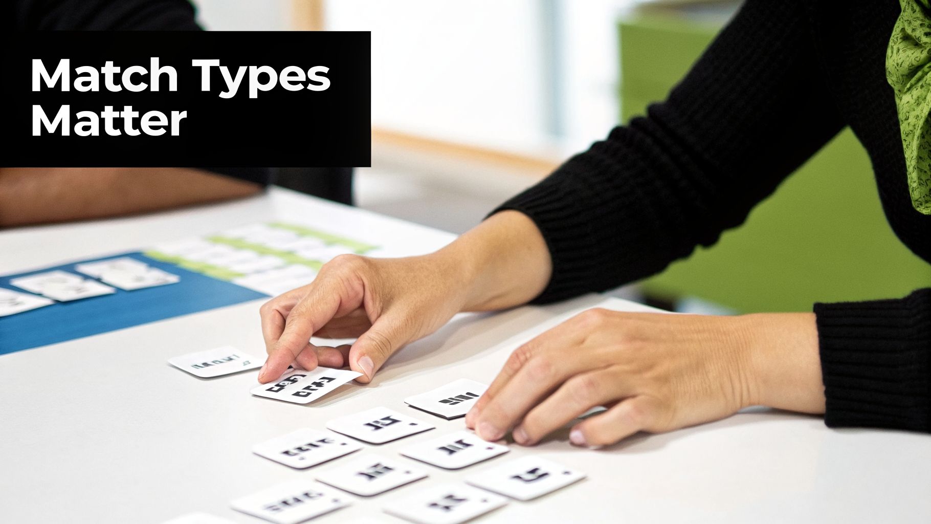 Hands arranging small white cards with symbols on a table, relevant to 'Match Types Matter'.
