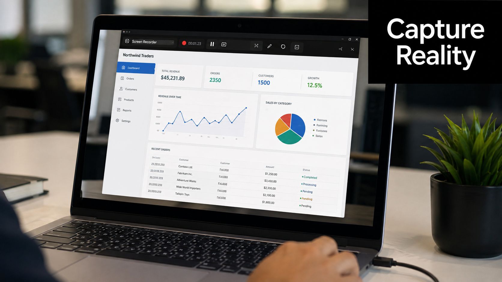 A person working on a laptop displaying a business dashboard with analytics, charts, and customer orders.