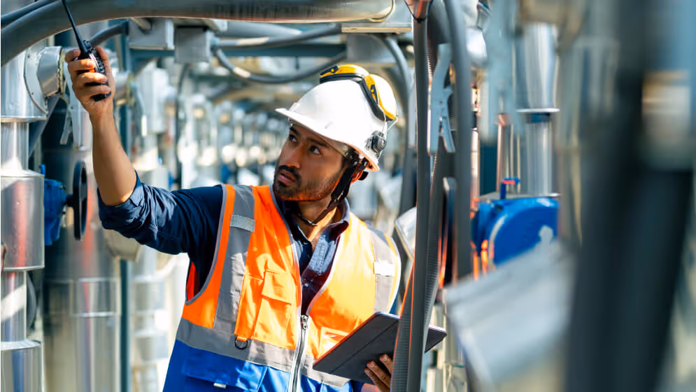 A technician doing a routine check of a facility.