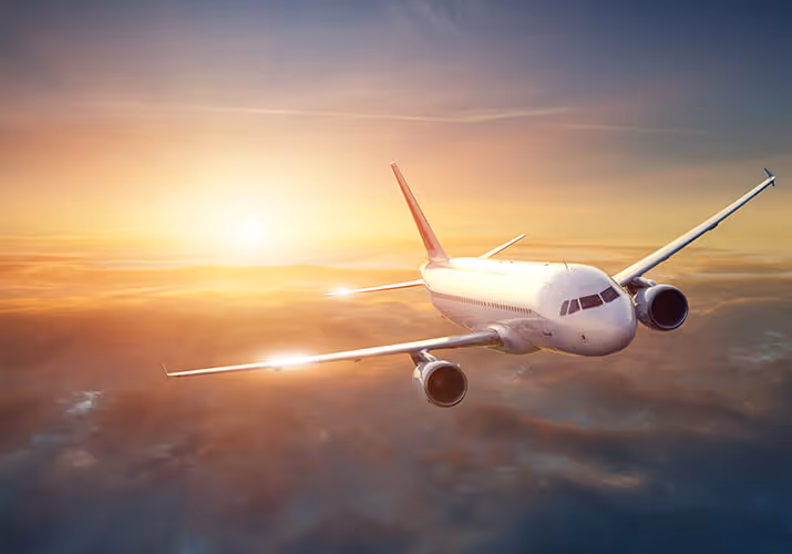 Plane flying above the clouds.