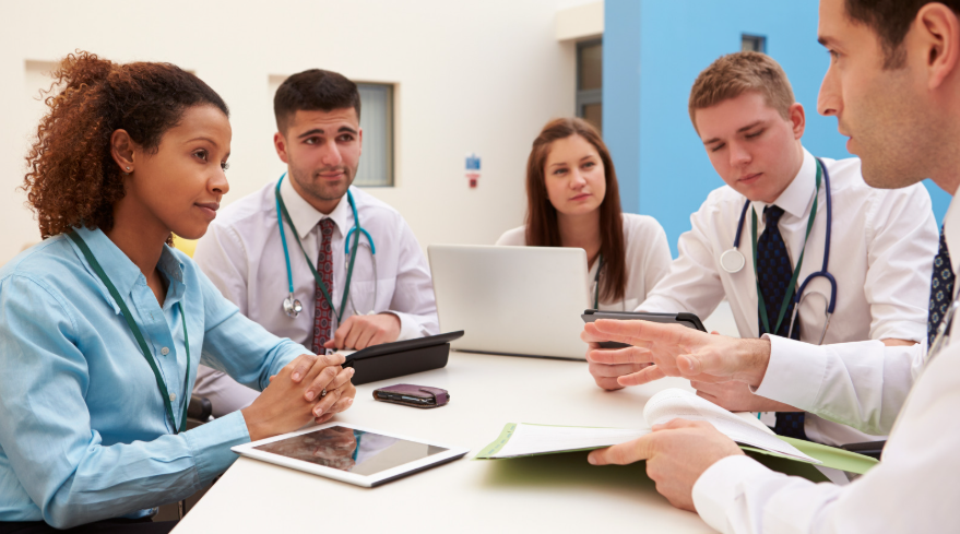 Medical team collaborating in a meeting to plan and review healthcare marketing strategies 