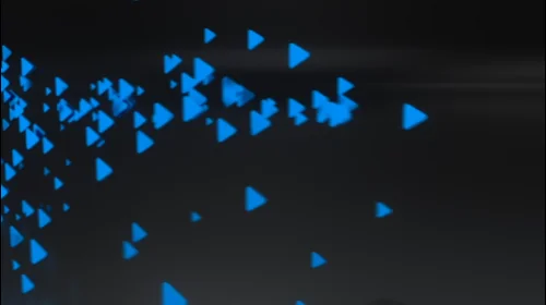 Cluster of small blue triangular shapes fall into place on the Flex box device.