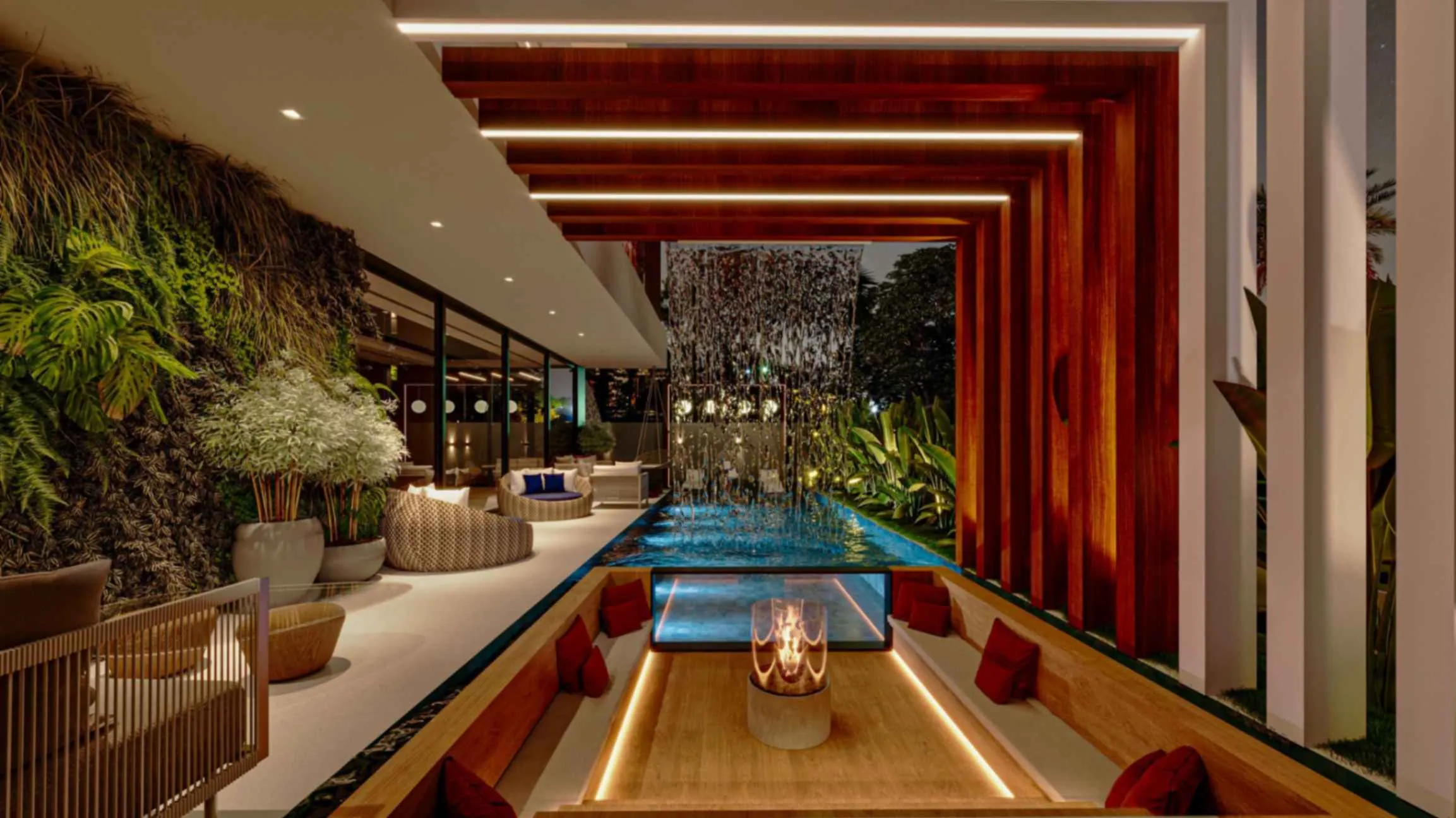 A modern indoor pool featuring a wooden deck and a cozy lounge area for relaxation.