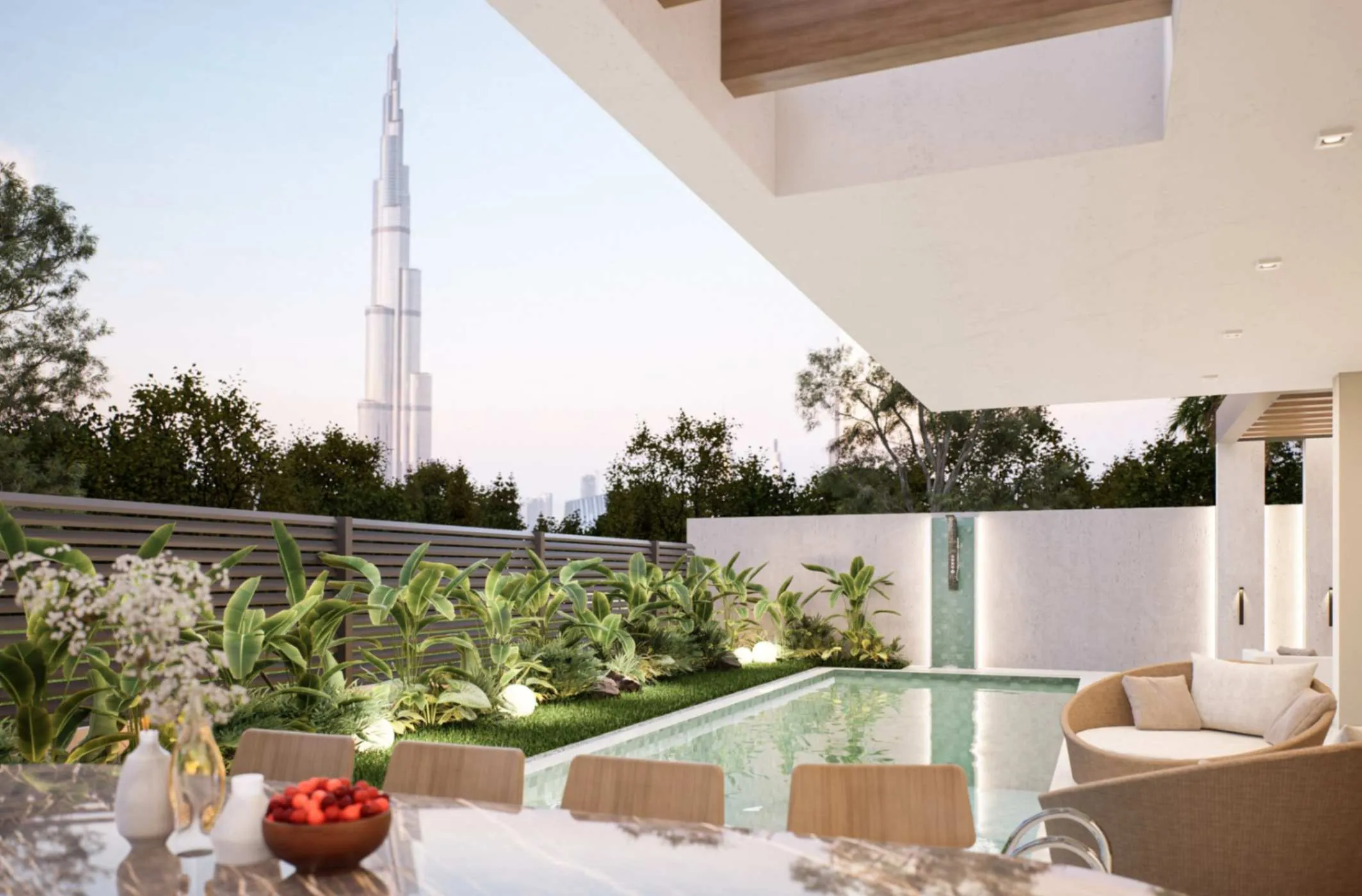 A beautiful pool and patio area overlooking the iconic Burj Khalifa, creating a peaceful and luxurious atmosphere.