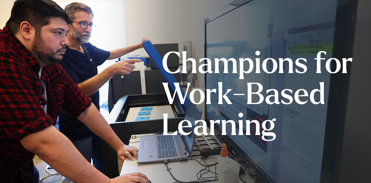In white, text says Champions for Work-Based Learning. There are two professionals in the background looking at computer screens. 