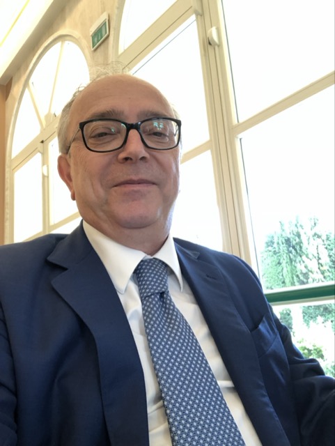 man in a coat serious looking