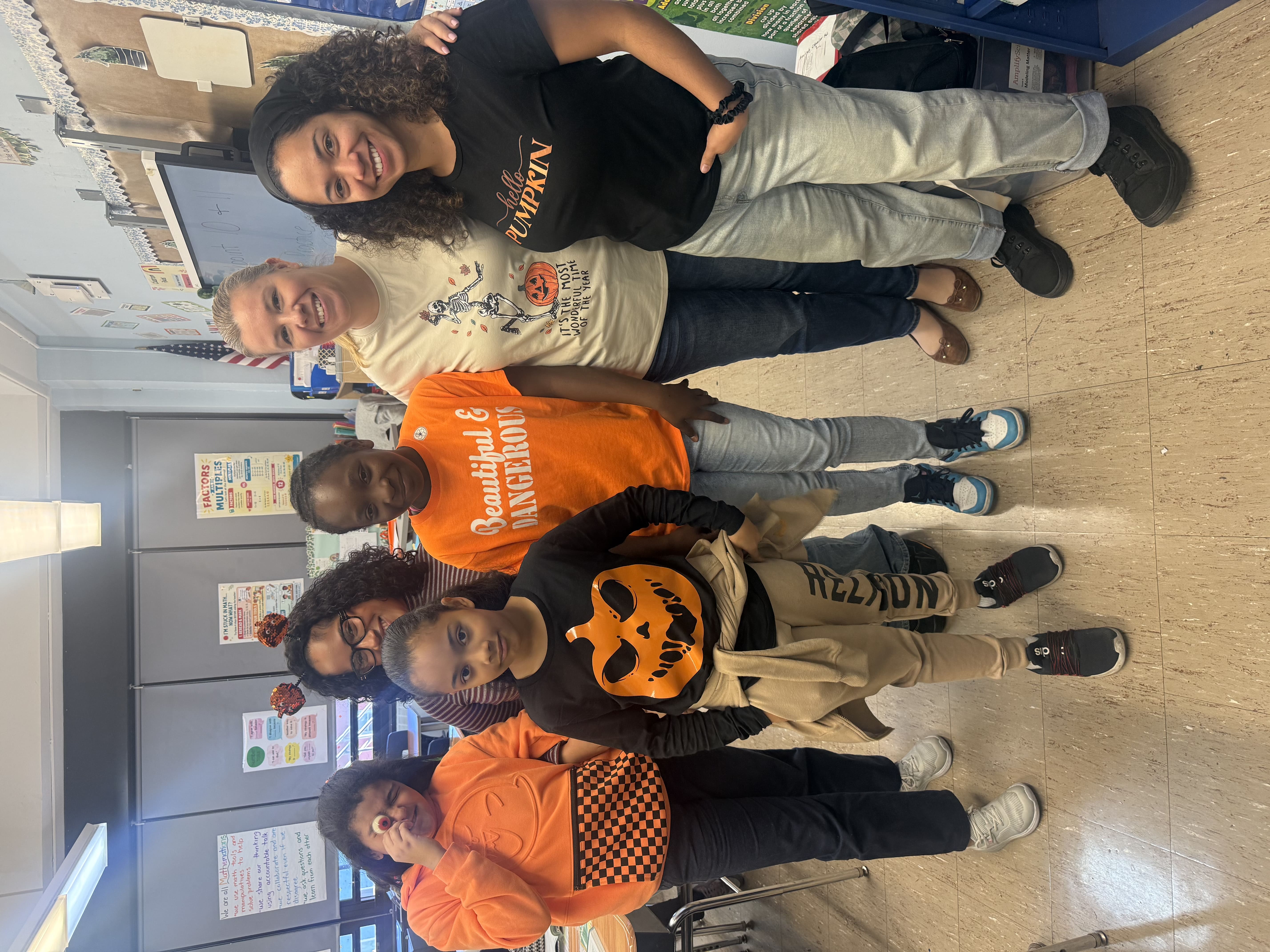 PS 152 teachers and students in orange and pumpkin shirts for Pumpkin Day