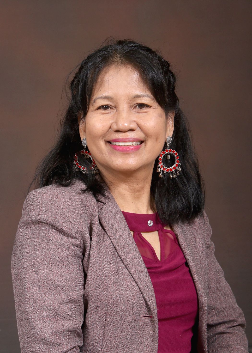 Ms Mondal smiling in professional staff directory portrait