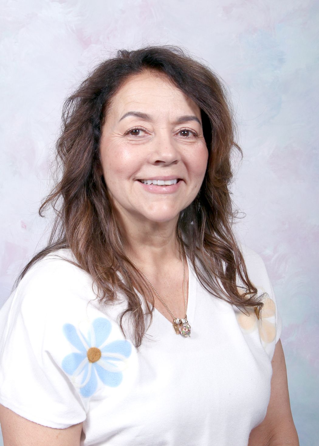 Ms. Turrisi smiling in a staff directory portrait photo
