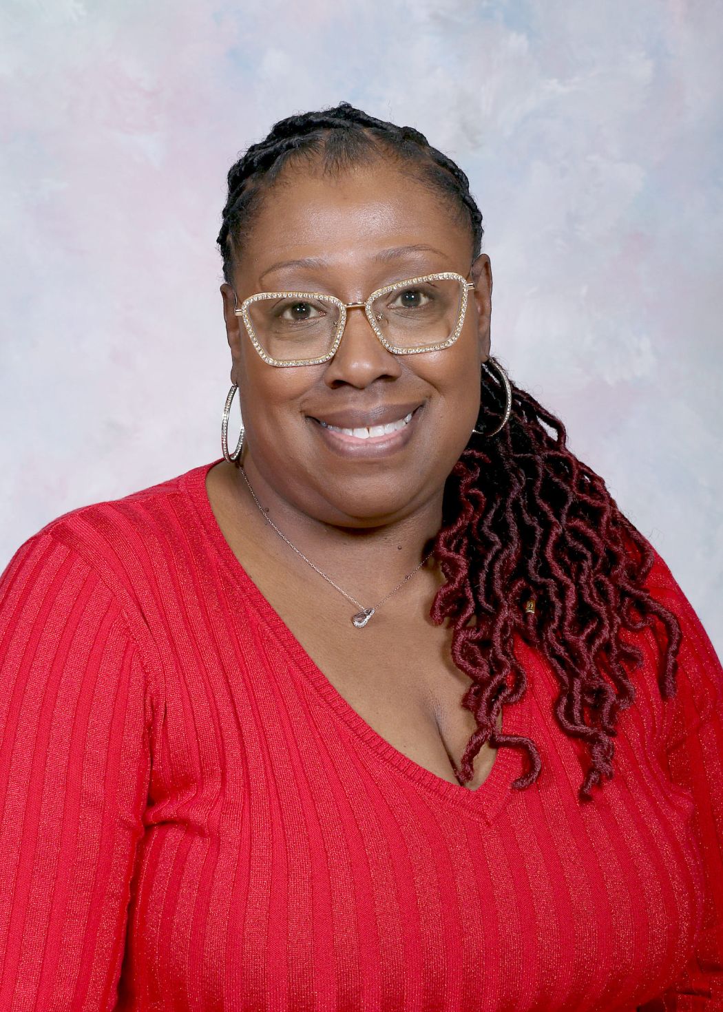Ms. Reneau smiling in a professional staff portrait photo