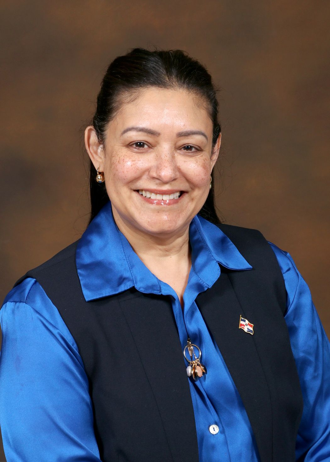 Ms C Santiago smiling in professional staff directory portrait
