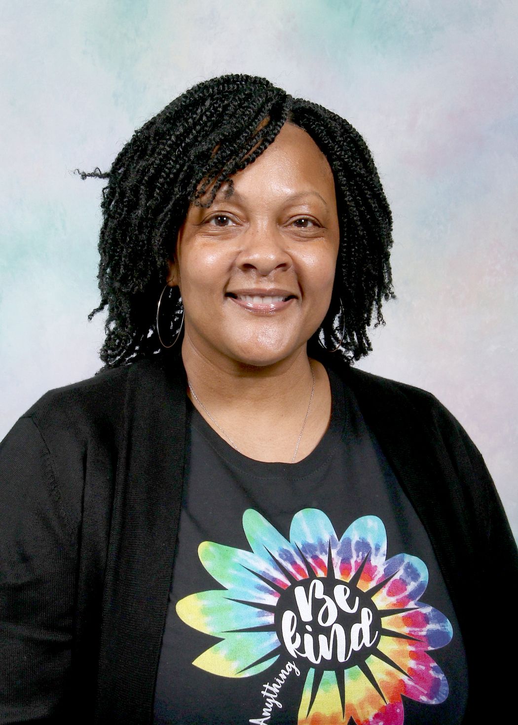 Ms. Nash-Pasco smiling in staff directory portrait photo