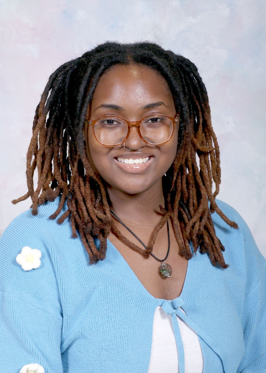 Ms. Mann smiling in staff directory portrait photo