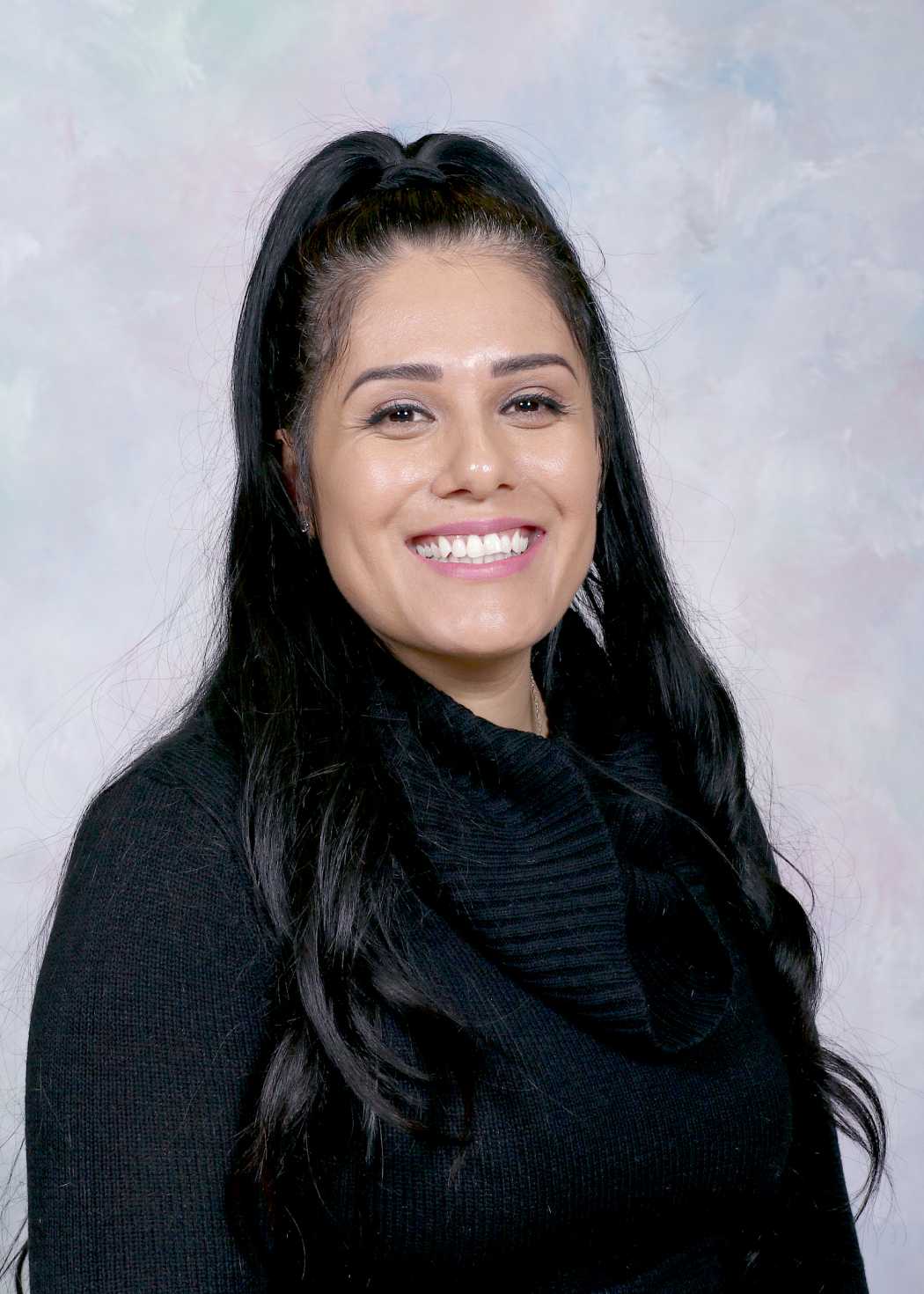Ms Barbara Martinez smiling staff portrait photo