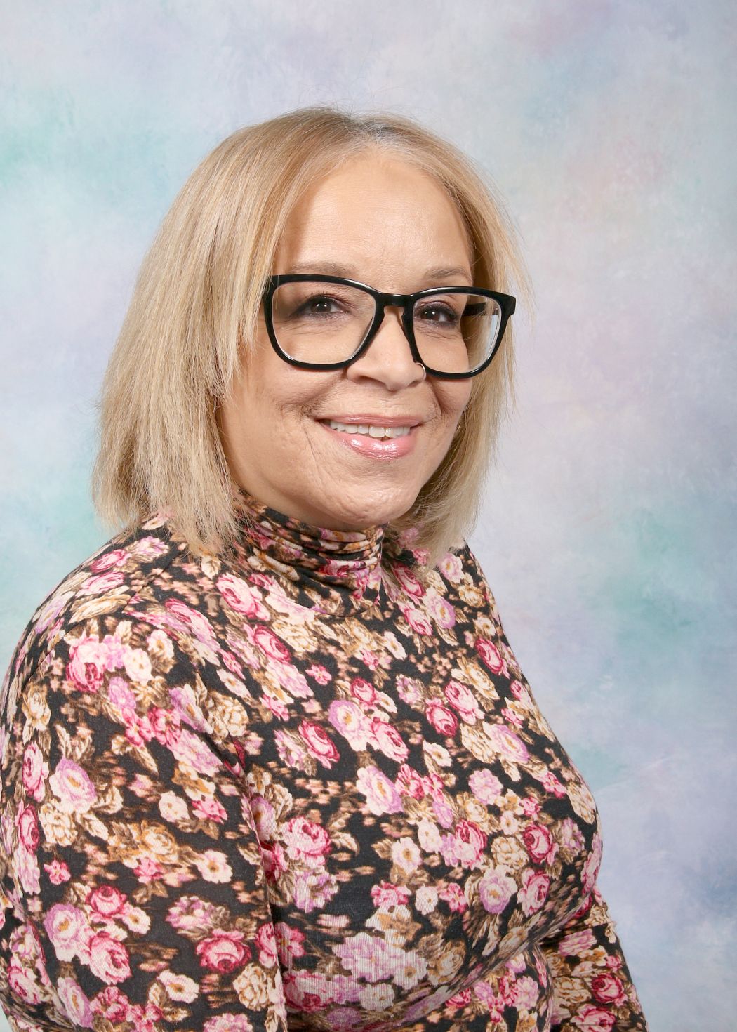 Ms. Garland smiling in a professional staff portrait photo