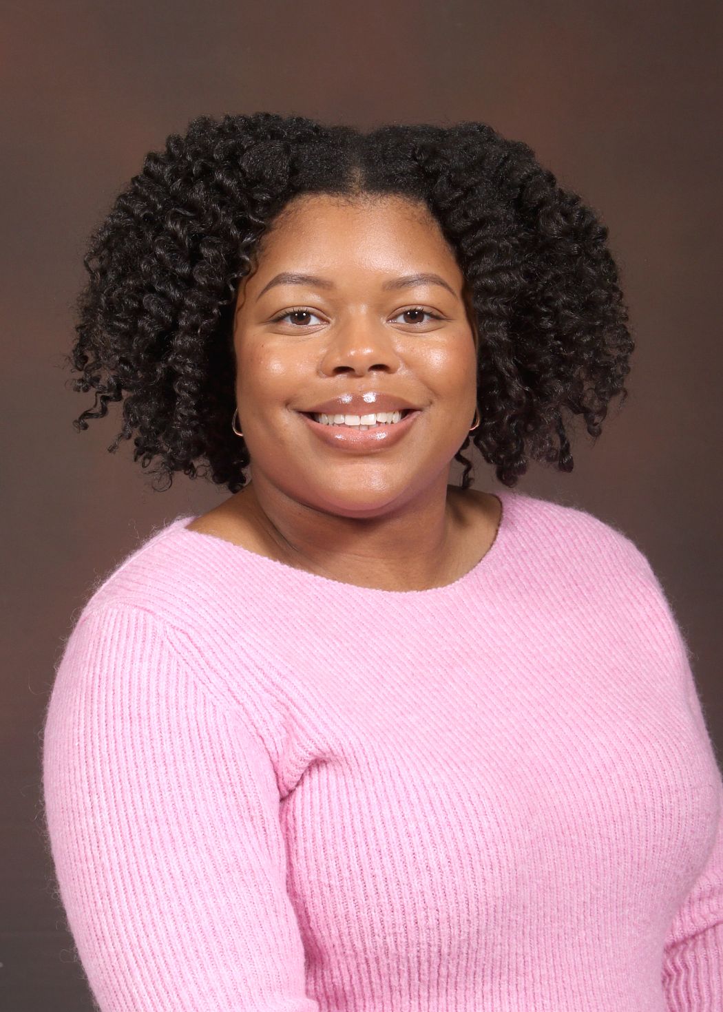 Ms. Bastien smiling in a professional staff portrait photo