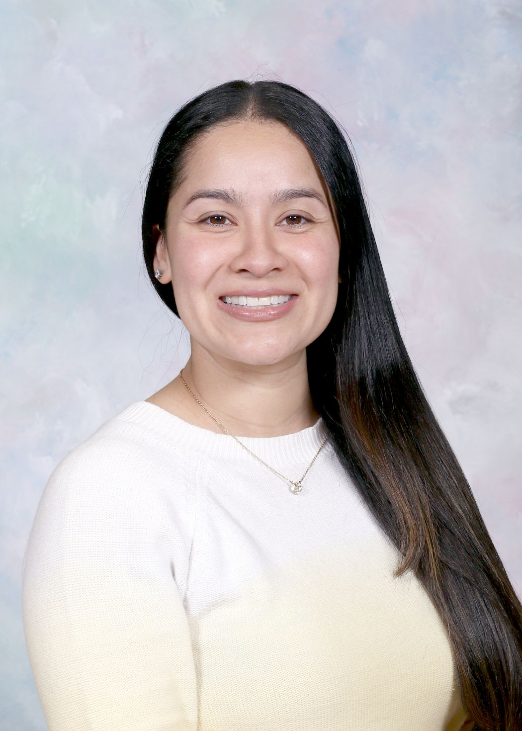 Mrs. Vidal smiling in a professional staff portrait photo