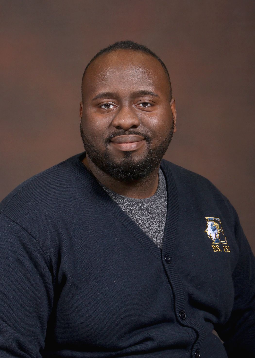 P.S. 152 staff member Mr. Bramble smiling in professional portrait