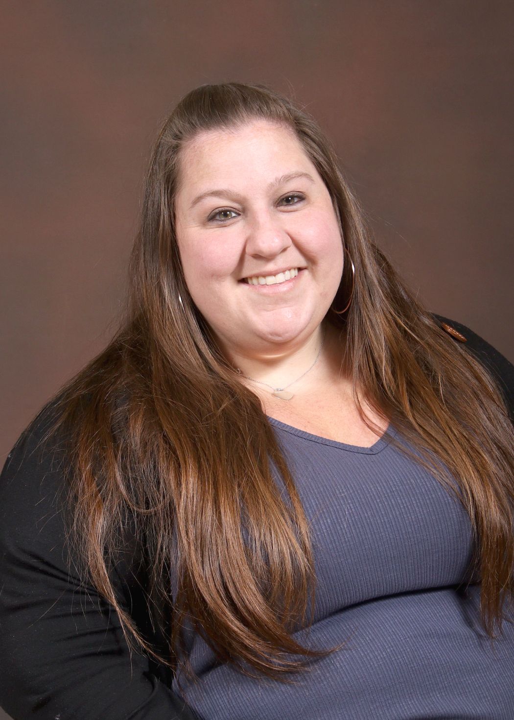 Ms. McGuire smiling in a professional staff portrait photo