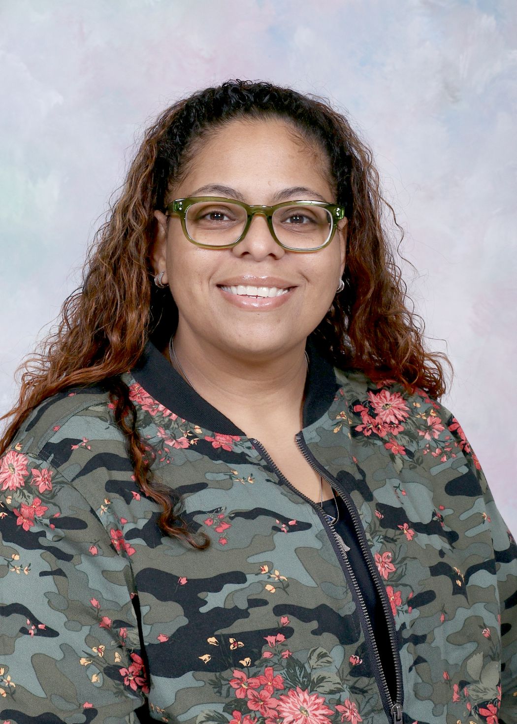 Ms. Collazo smiling in a staff directory portrait photo