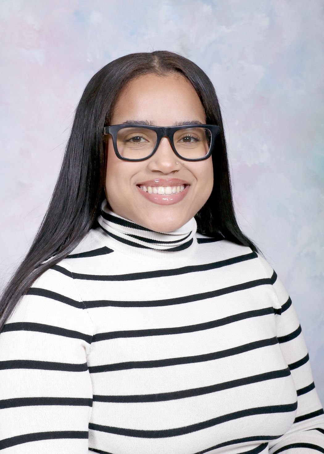 Ms. Valera smiling in a professional staff portrait photo