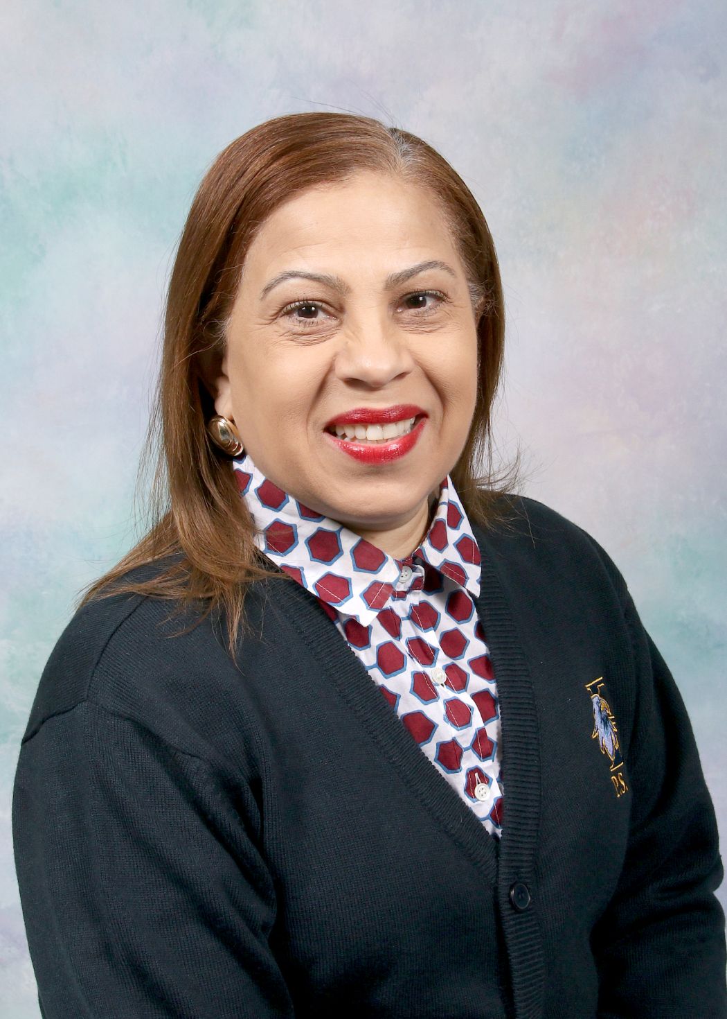 Ms. Ferreira smiling in staff directory portrait photo