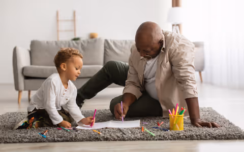 Grandfather playing with grandson