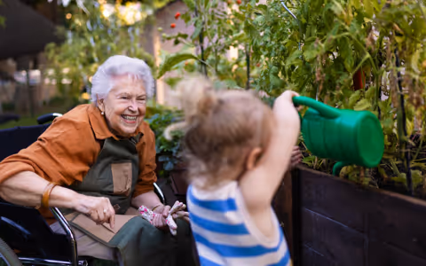 Grandmother with grandchild in garden