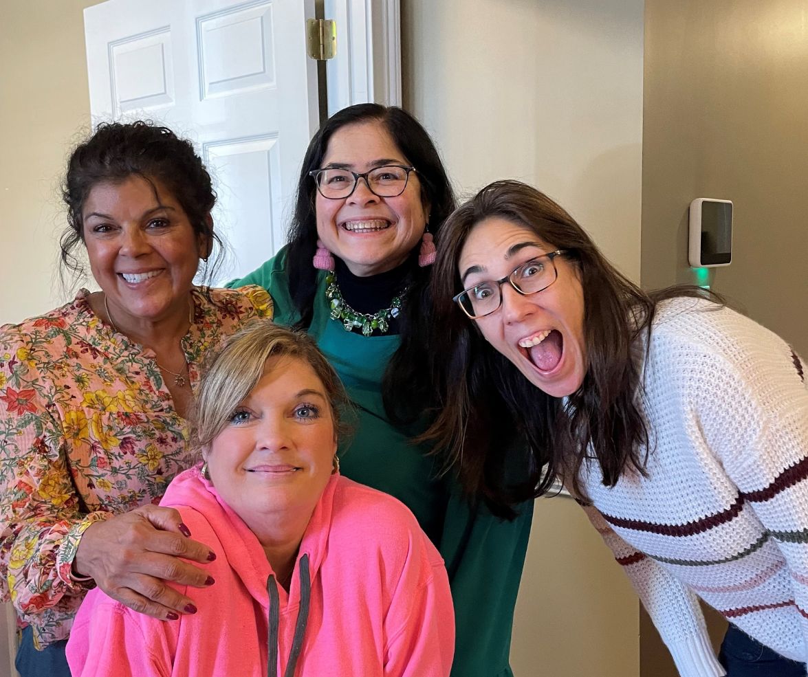 Four team members having fun at work.