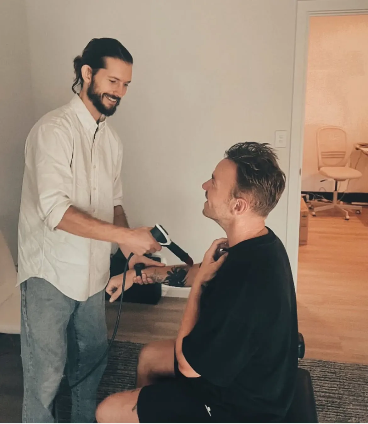 Luca providing shockwave therapy.