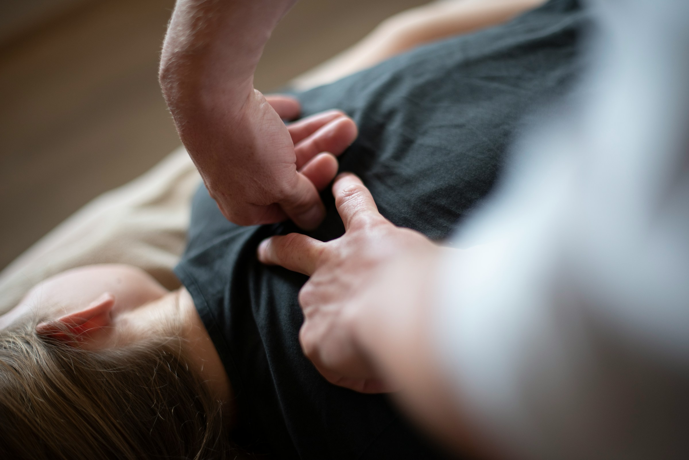 A person receiving a back massage.
