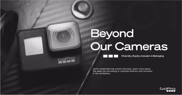 GoPro camera on a textured surface with text promoting diversity, equity, inclusion, and belonging.