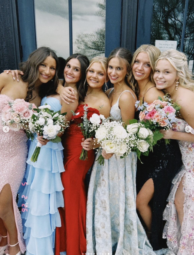 group of girls in prom dresses