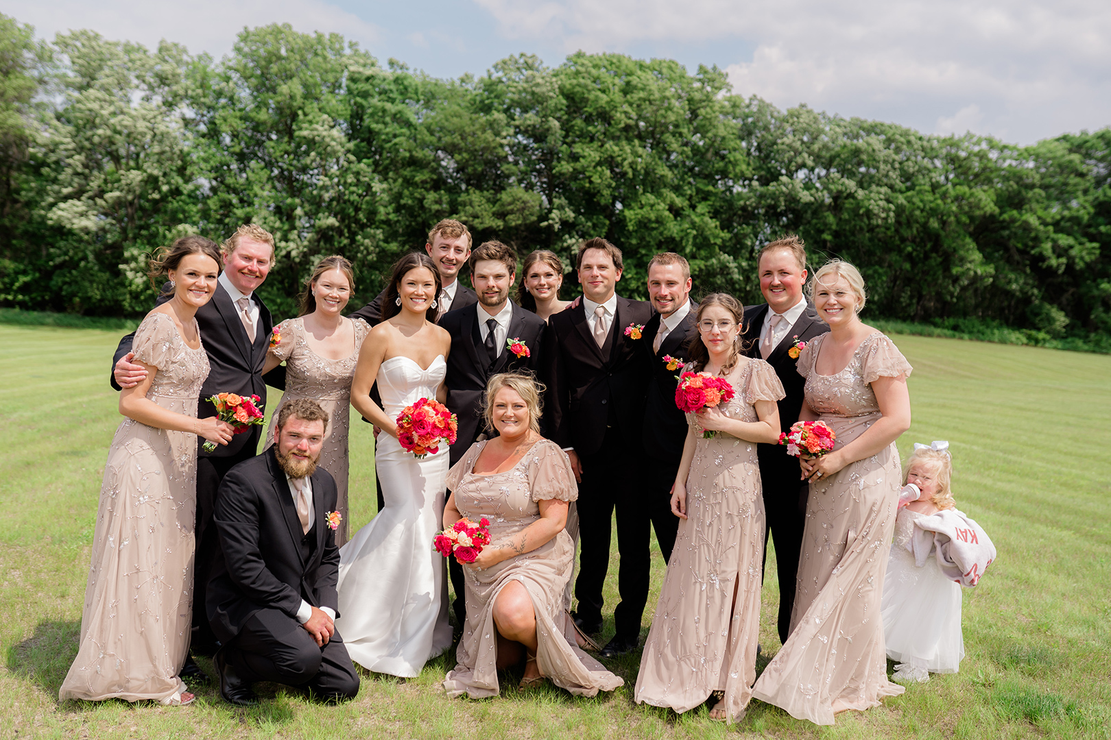 bridal party with wedding dress, bridesmaid dresses and tuxedos