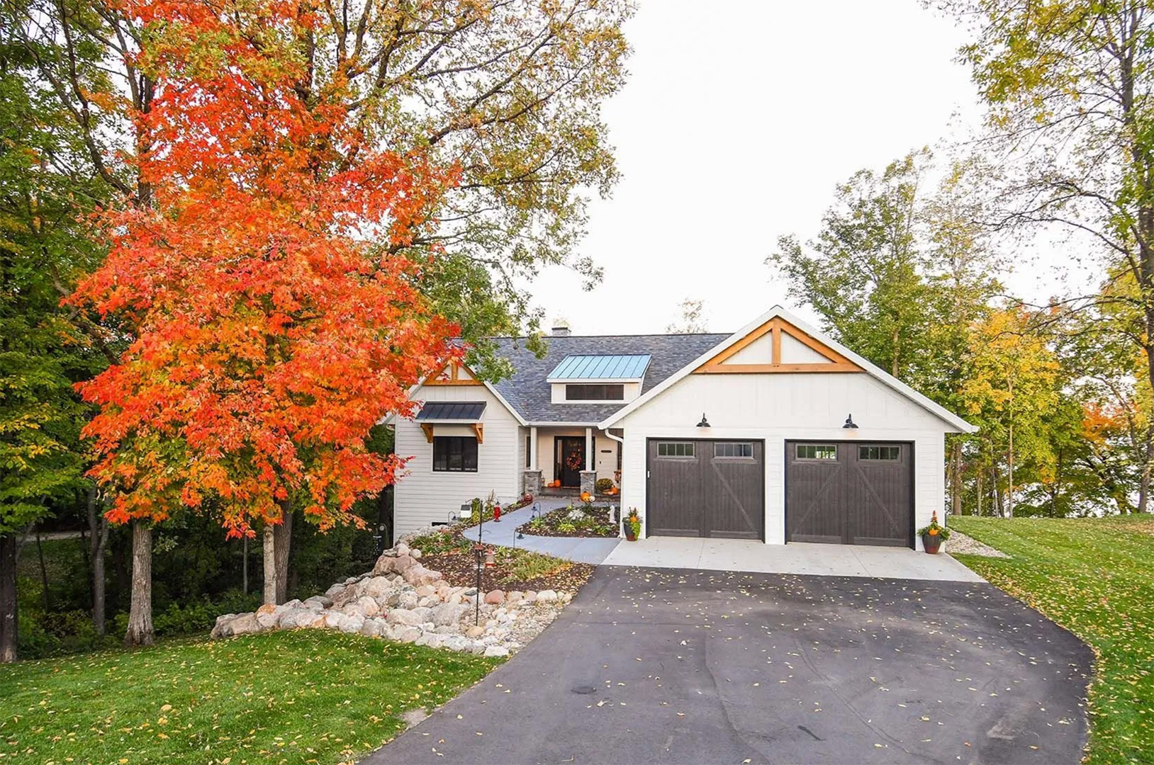 Viking Garage Door house with dark garage doors with windows
