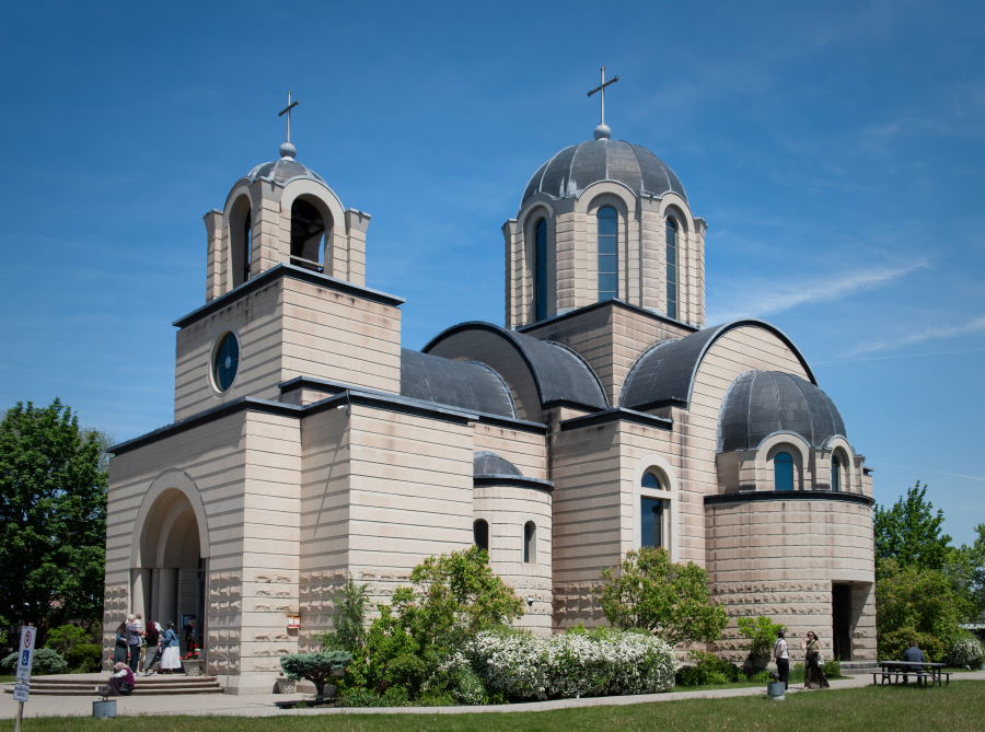 Stone-clad church with domed bell towers
