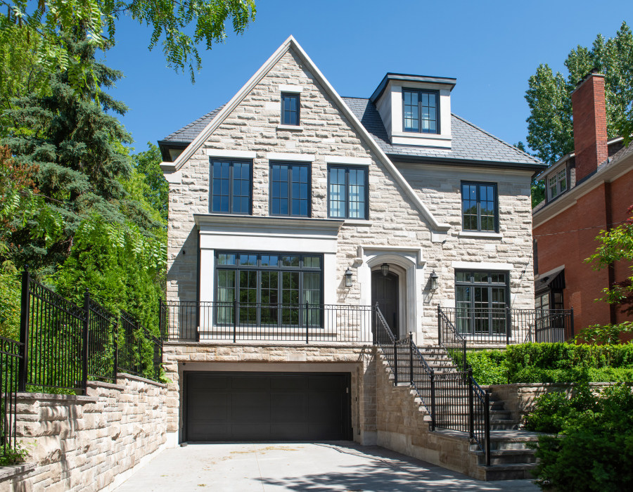 Stone-clad custom home with gabled roofline