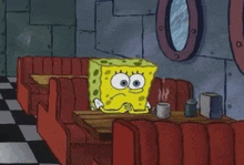 SpongeBob SquarePants sitting alone at a table in a diner, looking sad and contemplative.