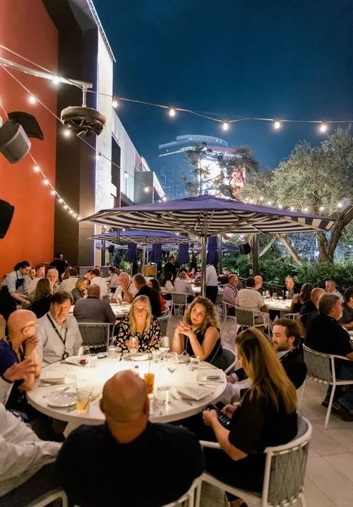Attendees engaged during a fine dining experience at an event planned by Stellify Events.