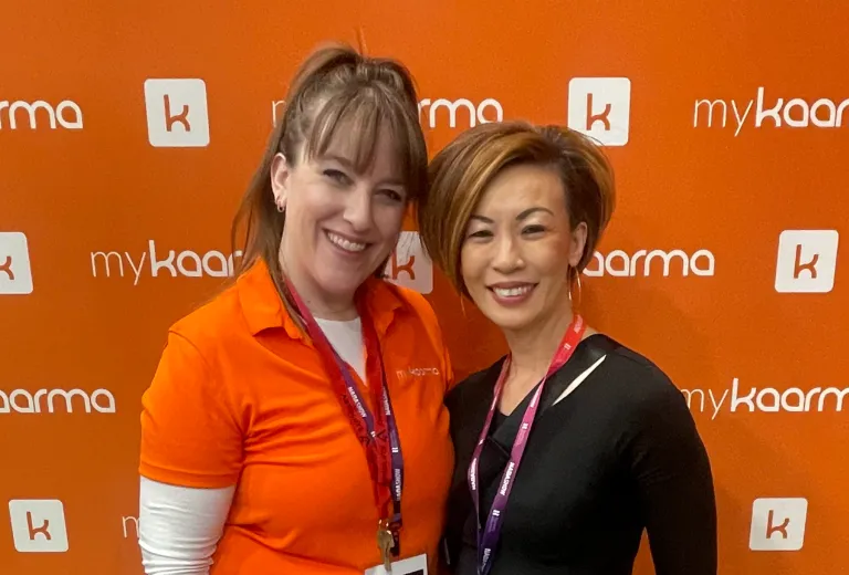 The client and Stef posing for a photo at a tradeshow event produced by Stellify Events.