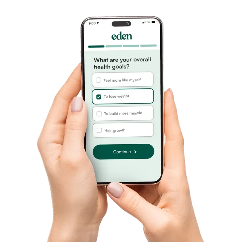 A woman's hand holding a phone completing an online survey