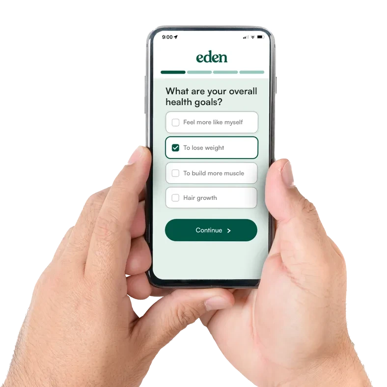 A man's hand holding a phone completing an online survey
