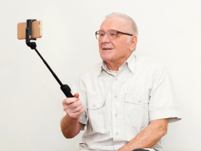 Senior man making a video eulogy to be played at his funeral or memorial.