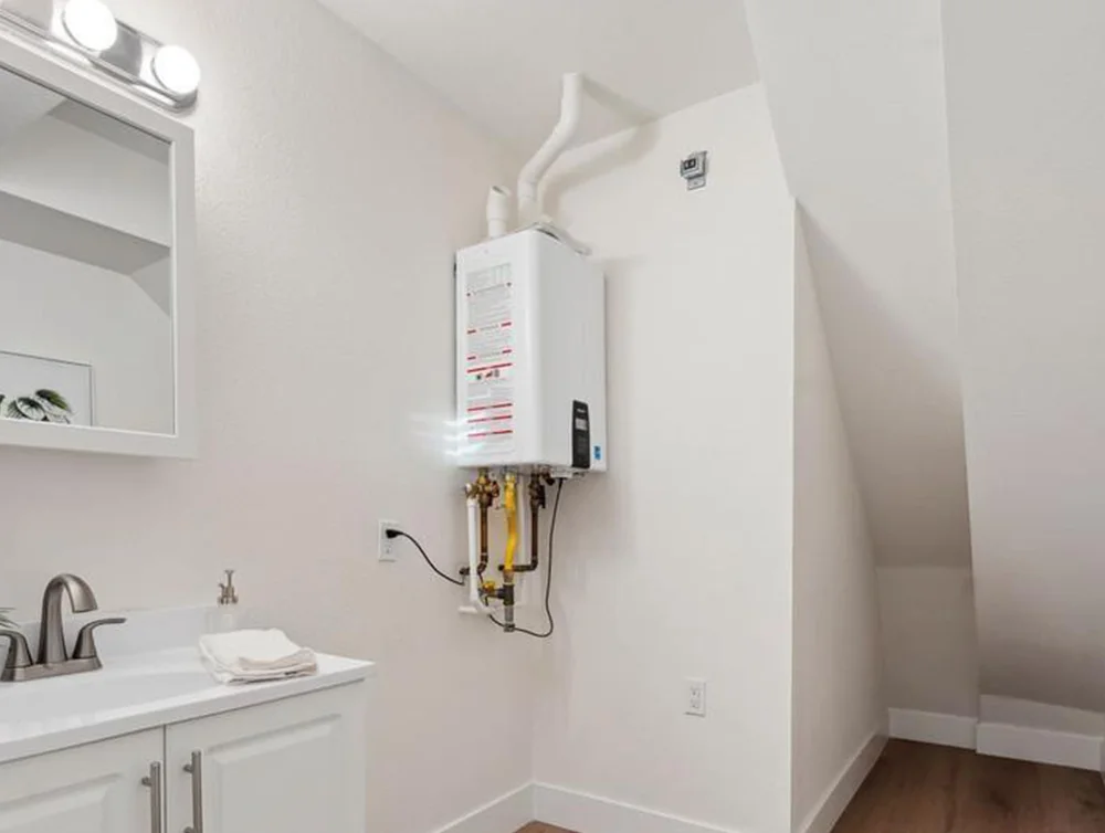 Water heating system of a house restorated after fire by Global Arch Construction