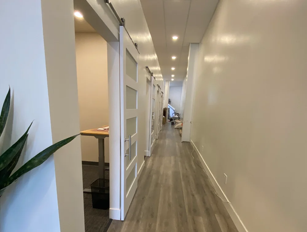 Hall of a chiropractor salon remodeled by Global Arch Construction